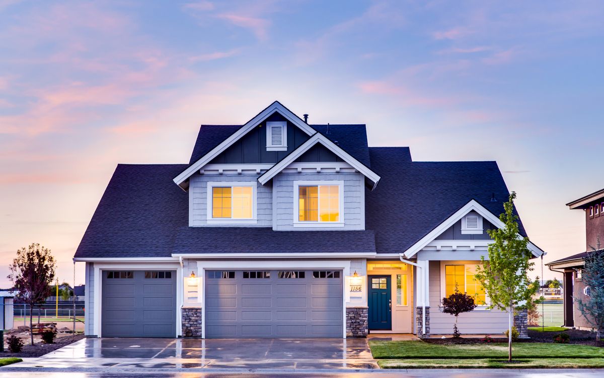 A house at dusk with lit windows